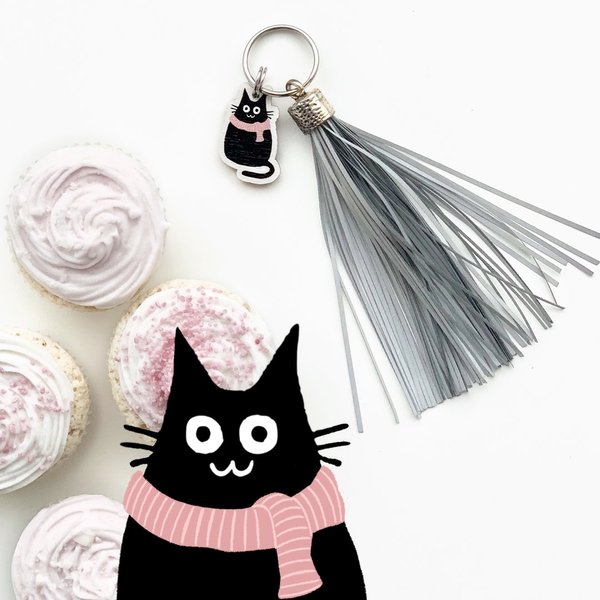 Cat with a scarf, reflective tassel